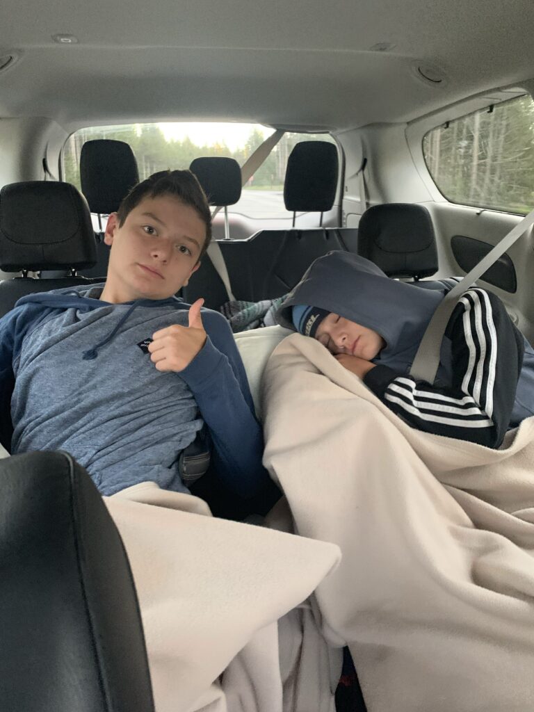 boys asleep car